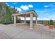 Picturesque outdoor gazebo with stone columns and a decorative roof, offering scenic views and seating at 3550 Fairwaters Ct # D, Clermont, FL 34711