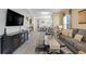 Spacious open-concept living area with dining and kitchen views, featuring modern decor and ample natural light at 3550 Fairwaters Ct # D, Clermont, FL 34711