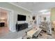 Inviting living room with TV, view to kitchen and dining, and entry to bedroom, perfect for relaxation at 3550 Fairwaters Ct # D, Clermont, FL 34711