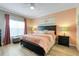 Comfortable main bedroom with natural light, stylish decor, and a serene ambiance at 3550 Fairwaters Ct # D, Clermont, FL 34711