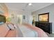 Bright and airy main bedroom with wood-look floors and ensuite bathroom access at 3550 Fairwaters Ct # D, Clermont, FL 34711