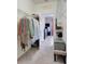 Organized walk-in closet with ample storage space and a view into the bedroom at 3550 Fairwaters Ct # D, Clermont, FL 34711