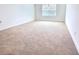 Bedroom with plush carpet and natural light at 358 Switchgrass Loop, Minneola, FL 34715
