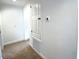 Hallway featuring neutral carpet and a white storage or utility closet at 358 Switchgrass Loop, Minneola, FL 34715