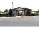 The community pool house entrance with convenient parking and easy accessibility. Includes lush landscaping at 358 Switchgrass Loop, Minneola, FL 34715
