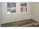 Bedroom featuring wood laminate floors and a window with natural light at 365 Fletcher Ave, Daytona Beach, FL 32114