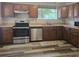 Updated kitchen with stainless steel appliances and wood-look flooring at 365 Fletcher Ave, Daytona Beach, FL 32114