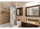 Bathroom featuring a vanity with granite countertop, a medicine cabinet, and a tiled shower/tub combo at 3809 Arlington Ridge Blvd, Leesburg, FL 34748