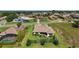 Aerial view of house with lush landscaping, mature trees, and a tranquil backyard near the neighborhood street at 39504 Hillrise Ln, Lady Lake, FL 32159