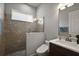 Modern bathroom with a tiled shower, glass enclosure, sleek vanity, and contemporary fixtures at 39504 Hillrise Ln, Lady Lake, FL 32159