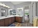 Spacious bathroom with double sinks, ample counter space, and modern lighting fixtures at 39504 Hillrise Ln, Lady Lake, FL 32159