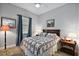 Comfortable bedroom with wood floors, a window with blinds, and decorative artwork at 39504 Hillrise Ln, Lady Lake, FL 32159