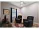 Relaxing bonus room with comfortable seating, a ceiling fan, and natural light at 39504 Hillrise Ln, Lady Lake, FL 32159