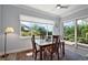 Inviting dining area with sliding glass doors to patio, offering seamless indoor-outdoor living at 39504 Hillrise Ln, Lady Lake, FL 32159