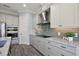 Modern kitchen with stone countertops, backsplash, and appliances at 39504 Hillrise Ln, Lady Lake, FL 32159