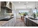Bright kitchen featuring modern appliances, a stylish backsplash, and an adjacent dining area at 39504 Hillrise Ln, Lady Lake, FL 32159