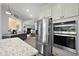 Contemporary kitchen with stainless steel appliances and granite countertops at 39504 Hillrise Ln, Lady Lake, FL 32159