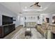 Cozy living room featuring a ceiling fan and comfortable seating at 39504 Hillrise Ln, Lady Lake, FL 32159