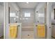 Stunning glass enclosed shower with dual shower heads and seat at 39504 Hillrise Ln, Lady Lake, FL 32159