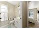 Bright bathroom with fresh towels and a window providing natural light at 40140 Palm St, Lady Lake, FL 32159