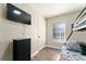 Bedroom featuring a bunk bed, dresser, and a mounted television offering comfort and style at 40140 Palm St, Lady Lake, FL 32159