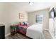 Bedroom featuring laminate floors, comfortable bedding and a view to the exterior at 40140 Palm St, Lady Lake, FL 32159