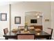 Dining area featuring seating for six, with an archway view of the living room, blending style and functionality at 40140 Palm St, Lady Lake, FL 32159
