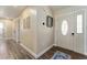 Inviting entryway features wood-look flooring and a door with decorative glass at 40140 Palm St, Lady Lake, FL 32159