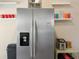 Kitchen featuring a stainless steel refrigerator, ample storage, and modern appliances for efficient meal preparation at 40140 Palm St, Lady Lake, FL 32159