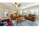 Cozy living room with tile flooring, neutral walls, and comfortable seating arrangement at 40140 Palm St, Lady Lake, FL 32159