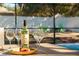 A relaxing outdoor scene with a bottle of wine, cheese, and raspberries next to the pool at 40140 Palm St, Lady Lake, FL 32159