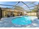 A stunning screened-in pool and backyard area perfect for outdoor living and entertaining at 40140 Palm St, Lady Lake, FL 32159