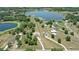 Aerial view of large property with lake, treeline, and perimeter outlined in white at 40143 Babb Rd, Umatilla, FL 32784