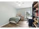 Bright bedroom with wood floors, ceiling fan and natural light from the outdoor view at 40143 Babb Rd, Umatilla, FL 32784