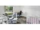 Bright Bedroom with hardwood floors, neutral paint, and backyard view at 40143 Babb Rd, Umatilla, FL 32784