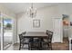Dining room with backyard view, wooden floors, and chandelier lighting at 40143 Babb Rd, Umatilla, FL 32784