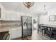 Spacious kitchen with stainless appliances, granite counters, eat in area, and backyard access at 40143 Babb Rd, Umatilla, FL 32784