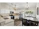 Bright kitchen features stainless steel appliances, granite countertops, and dining area at 40143 Babb Rd, Umatilla, FL 32784