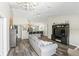 Stylish living room with high ceilings, wood floors, chandelier, and open to kitchen at 40143 Babb Rd, Umatilla, FL 32784