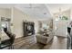 Open living room features hardwood floors, neutral paint, and a large window at 40143 Babb Rd, Umatilla, FL 32784