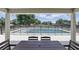 Relaxing outdoor pool view surrounded by a fence for safety and a table set for dining at 40143 Babb Rd, Umatilla, FL 32784