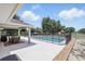 Backyard with a screened-in pool and patio, perfect for outdoor entertaining and relaxation at 40143 Babb Rd, Umatilla, FL 32784