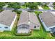 Beautiful home with screened lanai, lush landscaping, and well-manicured lawn at 4083 Capland Ave, Clermont, FL 34711