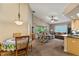 Open concept living area with a dining table and chairs, comfortable seating, and a view to the outside at 4083 Capland Ave, Clermont, FL 34711