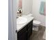 Bathroom featuring a modern vanity with a granite countertop, sink, and adjacent toilet at 41 Dogwood Loop, Ocala, FL 34472