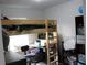 Shared bedroom featuring bunk beds, study desk, and compact storage solutions at 41 Dogwood Loop, Ocala, FL 34472
