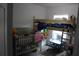 Shared bedroom with bunk beds, air conditioning, and play area at 41 Dogwood Loop, Ocala, FL 34472