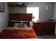 Comfortable bedroom with wood-toned furniture and a bright window at 41 Dogwood Loop, Ocala, FL 34472