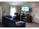 Comfortable living room with ample seating, large screen TV, and natural light at 41 Dogwood Loop, Ocala, FL 34472