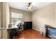Functional room with laminated wood flooring, window and desk at 43 Almond Pass Dr, Ocala, FL 34472